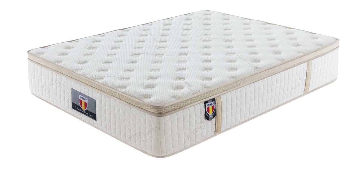 Husky Five Star Trinity 13.5 inch pocket coil mattress with organic cotton cover, angled view