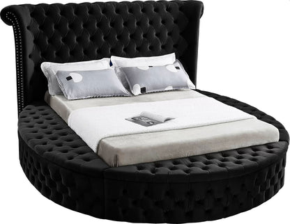 Alora round storage bed in black velvet, side angle on white