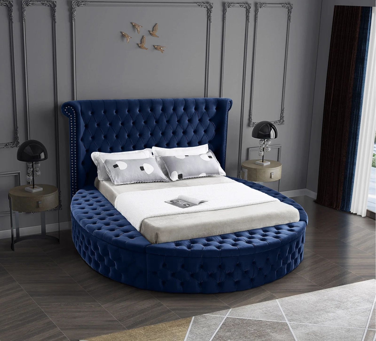 Alora round storage bed in blue velvet in a bedroom, front view