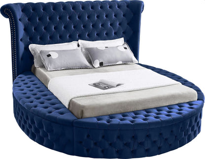 Alora round storage bed in blue velvet, side angle