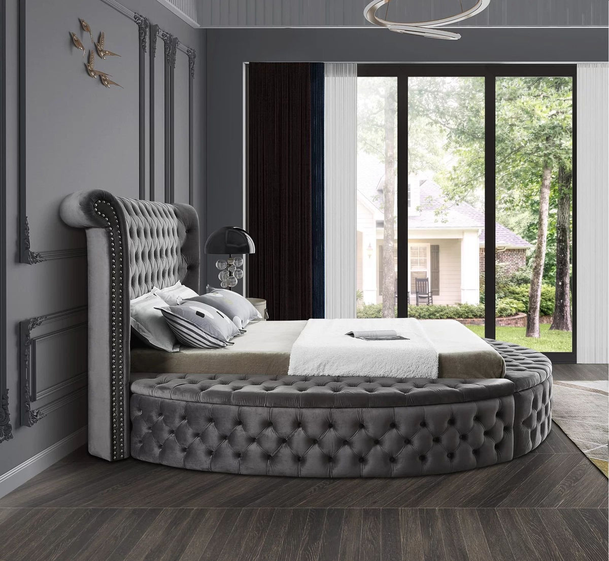 Alora round storage bed in grey velvet, side view in a bedroom