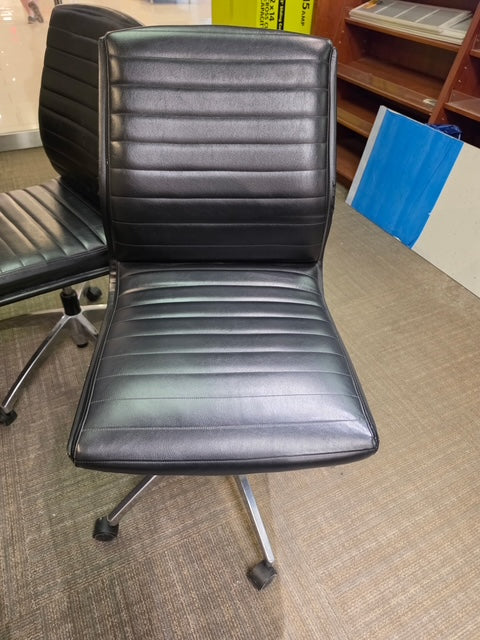 Black vinyl desk chair, front view
